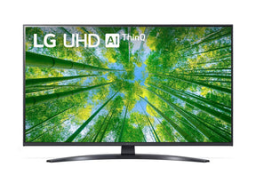 LG 60UQ8100 4K Smart TV előlnézetben, talpon. A kijelzőn sárgás zöld bambusz erdő és lg uhd thinq ai logó.